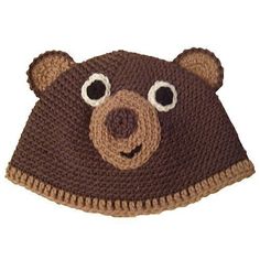 a crocheted bear hat with googly eyes