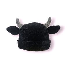 a black and white hat with horns on it