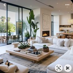 a living room filled with furniture and a fire place