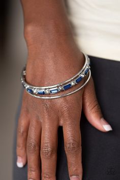 Two dainty silver bangles join a round hematite and emerald style blue rhinestone encrusted bangle around the wrist creating glittery stacks. Sold as one individual bracelet. P9ED-BLXX-046XX Blue Bracelets, Paparazzi Fashion, Emerald Style, Feeling Pretty, Rose Quartz Stone, Paparazzi Accessories, Colored Gems, Blue Gems, Copper Chain