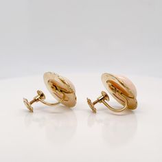 A very fine pair of Mid-Century Italian screw back earrings.  With large smooth oval cabochons framed in 18k gold rope design settings.   With screwbacks closures to the reverse.  Simply a lovely pair of Mid-Century Italian earrings!  Date: Mid-20th Century  Overall Condition: They are in overall good, as-pictured, used estate condition with some very fine & light surface scratches and other signs of expected light wear consistent with age.  Fineness: Mark 750 for gold fineness.   Marks: 750 & a Antique Yellow Gold Cabochon Earrings, Classic Oval Cabochon Clip-on Earrings, Luxury Yellow Gold Oval Clip-on Earrings, Luxury Oval Yellow Gold Clip-on Earrings, Yellow Gold Oval Clip-on Earrings With Polished Finish, Formal Clip-on Earrings With Oval Cabochon, Gold Oval Cabochon Clip-on Earrings, Oval Cabochon 14k Gold Earrings, 14k Gold Oval Cabochon Earrings