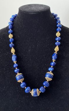 Trifari TM blue plastic, gold plated filigree beaded necklace  Very good to excellent condition  marked: Trifari TM  L - 26.75" with clasp, large beads diameter 7/8"  wt.: 2.9 oz.  04/25/24 1988 Blue Polished Beads Costume Jewelry, Elegant Large Blue Beads, Elegant Blue Large Beads, Blue Costume Jewelry Necklace With Large Beads, Blue Beaded Jewelry For Festive Occasions, Festive Blue Jewelry With Polished Beads, Formal Blue Single Strand Beaded Necklace, Blue Beads For Jewelry Making And Festivals, Festive Blue Polished Bead Necklace