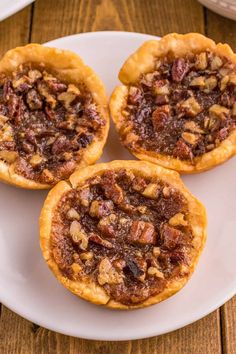 three pecan pies sitting on top of a white plate