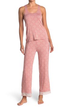 Lounge in ultimate comfort in this super soft scoop neck tank and pajama bottoms set. 2-piece set Top: 24" length; Pants: 13" rise, 29" inseam (size S) Top: scoop neck, sleeveless, racerback, knit construction, lace trim Bottoms: elasticized drawstring waist, pull-on style, knit construction, lace trim 95% rayon, 5% spandex Machine wash Imported Model’s stats for sizing: 5’11” height, 32” bust, 24” waist, 34” hips. Model is wearing size S. Comfortable Pajama Party Sets With Long Pants, Comfortable Long Pants Sets For Pajama Party, Stretch Long Pants Sets For Sleepover, Sleepover Sets With Stretch And Long Pants, Stretch Sets With Long Pants For Sleepover, Casual Sleep Sets With Long Pants, Casual Sleeveless Lounging Sets, Casual Sleepwear Set With Long Pants, Casual Loungewear Sets With Long Pants