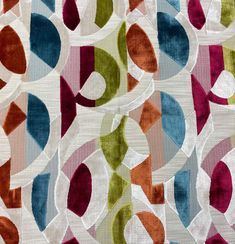 an image of a colorful fabric with circles and lines on it's surface,