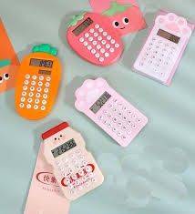 four cell phones are sitting next to each other on a blue tablecloth with pink and orange designs