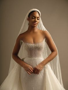 a woman wearing a wedding dress and veil