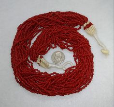 Vintage beautiful Multi Strand Necklace Rich Red Coral small Seed Beads necklace there 24 strands This is a truly wonderful necklace that wears well with many different styles. Should be super for you or as a special gift. Beads are Measuring as seen Necklace is approx. 22 inches end to end length. Red Multi-strand Beads For Gift, Seed Beads Necklace, Bezel Necklace, Black Onyx Necklace, Onyx Necklace, Seed Bead Necklace, Sterling Silver Necklace Pendants, Cross Jewelry, Multi Strand Necklace