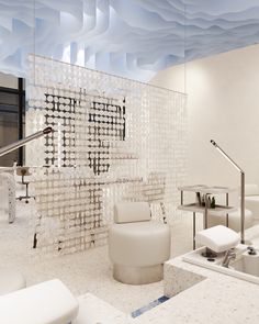 an artisticly designed bathroom with white furniture