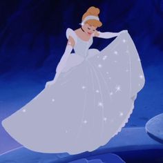 a woman in a white dress is dancing with snow flakes on her skirt and headband