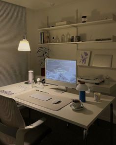 a white desk with a computer on it