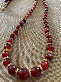 Handmade necklace made with Carnelian beads and golden spacers   Beautiful addition to any collection. Fall colors. One of a kind. Luxury Beaded Carnelian Necklace, Luxury Elegant Carnelian Beaded Necklaces, Amber Round Beads Costume Jewelry Necklace, Amber Round Beaded Costume Necklace, Vintage Carnelian Amber Necklace, Amber Beaded Costume Jewelry Necklaces, Amber Beaded Costume Jewelry Necklace, Vintage Beaded Carnelian Necklace, Vintage Carnelian Beaded Necklace