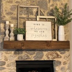 a fireplace with a sign that says home is wherever we are together