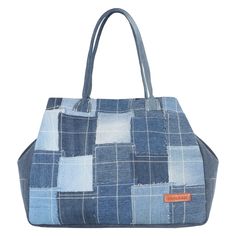 a blue and white patchwork bag on a white background