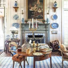 an image of a living room with blue and white decor on the fireplace mantel