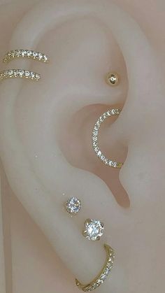 three different types of ear piercings on top of each other