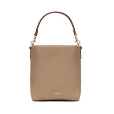 The Carrie Bucket Bag is a stylish and functional staple piece made of full-grain Italian pebbled leather. It features a spacious interior with a zipper closure, a top handle, an adjustable webbing strap, and luxurious leathered lining. Its classic silhouette, gold-plated hardware, and essential color options make it a versatile accessory that can elevate any outfit, perfect for the modern woman on-the-go. Classic Cream Bucket Bag With Gold-tone Hardware, Cream Tote Bucket Bag With Gold-tone Hardware, Cream Shoulder Bucket Bag With Gold-tone Hardware, Luxury Beige Bucket Bag With Gold-tone Hardware, Beige Rectangular Bucket Bag With Gold-tone Hardware, Parisa Wang, Leather Interior, Staple Pieces, Simple Elegance