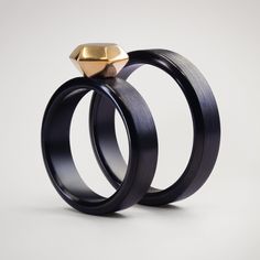 Black Brushed Zirconium bands. Diamond made of 18K Gold. Hypoallergenic metal. Available engraving. Available in sizes US 4 - 14. Custom sizes are available upon request, please contact me for details. -- SPECIFICATIONS -- Materials: Zirconium/ Brushed / 18K Gold Dimensions: 5/6 mm x 1.9mm Lead time: 2 weeks + shipping Metal Zirconium has a similar grey-silver color to titanium. The dark grey/graphite (not flat black) color is the oxidation effect which can only be formed when put to flame. This Concrete Wedding, Damascus Ring, Carbon Fiber Rings, Etsy Wedding Rings, Matching Wedding Bands, Wide Rings, Titanium Rings, Wooden Rings, One Ring