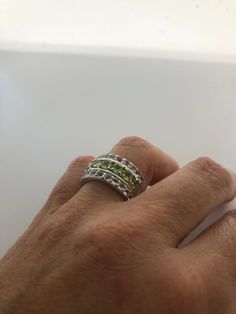 Rich bright Peridot green and white sapphire ring Sterling silver Tarnished with age, can be polished up. Size 8 can be sized by my jeweler. His service charge is $10-$20 All rings are shipped free in the US in a nice gift box. Check out our over a THOUSAND great reviews Engraving is $4 per letter and is not always perfect depending on the piece. It can take a few days if the jeweler is busy. This is payable to Paypal Judithsltd@gmail.com Green Diamond Multi-stone Birthstone Ring, Green Diamond Birthstone Ring With Multi-stone, Fine Jewelry With Channel Set Green Stones, Fine Jewelry Green Channel Set, Green Diamond Stackable Round Ring, Stackable Green Diamond Ring, Fine Green Jewelry With Channel Set, Green Stackable Round Diamond Ring, Green Channel Set Fine Jewelry