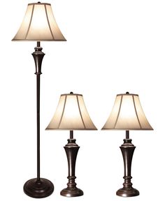 three lamps are sitting next to each other on a white background with one lamp turned off