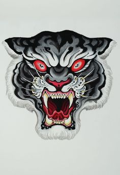 a black and white tiger with red eyes on it's face is seen in this image