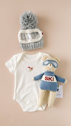 Put on your ski gear and join Benjamin Bear down the Frosty Mountains! He hits the slopes early for the fluffiest snow, and always makes sure to take hot coco breaks. Gift together with the matching blanket, sweater, and beanie. • Designed in Salt Lake City• 14" tall• 100% Organic Cotton, exclusive of trim• Recycled Polyester Fill