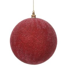 a red ornament hanging from a string