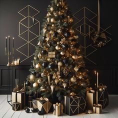 a christmas tree decorated with gold and black ornaments