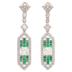 True elegance apparently can be summed up in a pair of earrings! These platinum stunners feature two extremely fine natural princess cut diamonds graded at G-VS and weighing 1.46cttw set between rows of perfectly matched vibrant green emeralds weighing 0.62cttw and accented by surrounding melee diamonds for another 0.44cttw, all coming together to create an absolutely beautiful pair of earrings. The pushback closures deliver maximum comfort and security for the wearer. The earrings measure just over 1.5" in length and weigh 8.8 grams total. Elegant design meets exceptional materials in this truly spectacular pair of earrings that bring together new construction with a vintage feel. These earrings are currently retailing for $12,750.00 Diana Ring, Alexis Bittar Jewelry, Sapphire And Diamond Earrings, Emerald Bracelet, Platinum Diamond Rings, White Gold Sapphire, Emerald Bead, Diamond Dangle Earrings, Estilo Art Deco