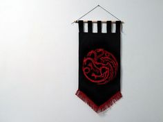 a red and black banner hanging on a wall