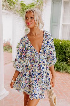 - Get a gorgeous, brunch ready look with this adorable babydoll dress! Its flirty neckline and relaxed fit give it a feminine touch. You are sure to make a lasting impression in this floral cutie! - Unlined lightweight material with a blue, pink, purple, green, and peach hued floral print - An elastic v-cut neckline - ¾ length, loose sleeves - An elastic waistline - A relaxed yet flattering silhouette that ends in a mini dress length hemline Sweet Dress, V Cuts, Babydoll Dress, Dresses Xs, Dress Length, Baby Dolls, Floral Prints, Sleeve Length, Relaxed Fit