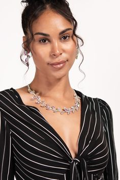 Add a touch of sparkle to your look with this elegant rhinestone leaf necklace and earring set. The necklace features a delicate chain adorned with sparkling leaves, while the matching earrings complete the set. Perfect for a special occasion or to add some glamour to your everyday look. This necklace and earring set is made with high-quality materials and will become a favorite in your jewelry collection. Make a statement with this beautiful rhinestone leaf set. SizeLength: 20.5 in (52.07 cm)Ex Elegant Leaf-shaped Jewelry For Formal Occasions, Elegant Leaf-shaped Formal Jewelry, Elegant Leaf-shaped Jewelry For Party, Elegant Leaf-shaped Jewelry, Elegant Leaf-shaped Party Jewelry, Silver Leaf-shaped Jewelry For Party, Pearl Shop, Holiday Essentials, Delicate Chain