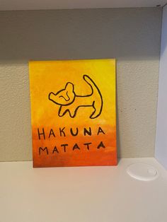 an acrylic painting of a dog with the words hakuna matata on it