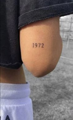 the back of a person's leg with numbers tattooed on it, in russian