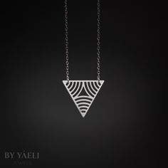 Triangular necklace- Beautiful triangle with circle stripes pendant, Featuring symmetrical  silhouettes.    ★ Comes in our signature gift box, ready for gift giving.  ★ Available in Silver [Sterling silver chain & silver plated pendant]  ★ Pendant size is: 1"x1". Thanks for shopping at ByYaeli♥  All images, texts & products are property of ByYaeli ©2020 Minimalist White Triangle Jewelry, Minimalist Geometric Sterling Silver Necklace, Modern Silver Geometric Necklace, Minimalist Silver Triangle Necklace, Minimalist Sterling Silver Triangle Necklace, Silver Triangle Necklace For Gift, Triangle Shaped White Jewelry For Gifts, White Triangle Jewelry Gift, White Triangle Jewelry For Gift