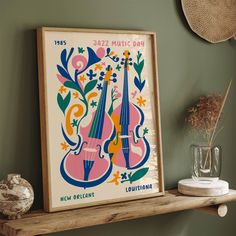 an art piece on a shelf next to a vase with flowers and music instruments in it