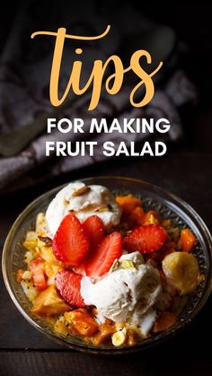 a bowl filled with fruit and ice cream on top of a wooden table