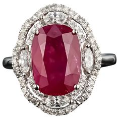 A stunning, certified, vivid red 5.40 carat Burmese heated Ruby and Diamond ring, set in 18K White Gold. The ring is currently sized at US size 7, and can be resized. The color of the center stone is ideal, and has great luster and is transparent. This deal is not to be missed, as this stone is a great investment! We provide free shipping, and accept returns. Please feel free to message us for more information! Ruby And Diamond Ring, Diamond Ring Set, Diamond Cocktail Ring, Diamond Cocktail Rings, Ruby Diamond, Burmese, Cocktail Ring, Cocktail Rings, Ring Set