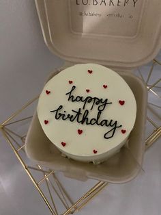 a birthday cake with the words happy birthday written on it