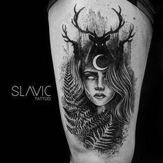 a woman with deer horns and moon on her head is depicted in this black and white tattoo