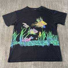 Vintage 90s Panama Jack Fish Water Ocean Travel Souvenir Single Stitch Streetwear 1990s Fashion Black Graphic T Shirt Extra Large Mens  Condition:  Excellent Used Condition  = No Flaws Measurements: Please see photos above for all measurements IF YOU BUY TWO OR MORE ITEMS USE THE CODE BUNDLE @ CHECK TO SAVE 20% WE SHIP WITHIN 24 HOURS AFTER PURCHASE! Please be aware that we do not offer free returns!! The Buyer is responsible for the cost of the return label.  Follow us on TikTok & Instagram @findsnostalgic and tag us in your finds Ocean Travel, Water Ocean, 1990s Fashion, Travel Souvenirs, Fashion Black, Panama, Black Fashion, Vintage 90s, Graphic T Shirt