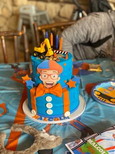 a birthday cake is decorated with cartoon characters