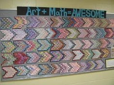 an art and math - awesomee display on the wall in front of a bulletin board