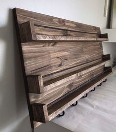 a wooden bench sitting in the corner of a room