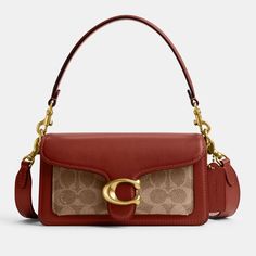 Swap out your old-time faithful with this Tabby 20 shoulder bag in red-brown polished leather. With a Coach-monogram compartment and brassy accents throughout, the piece could slot into various decades and is designed to last beyond the foreseeable future. With two shoulder strap carry options, it champions hands-free ease..Coach Signature Tabby 20 shoulder bag.Red-brown leather and tonal brown coated-canvas.Removable shoulder straps, monogrammed external compartment, designer tab.Two main internal compartments, one zipped internal compartment, fully lined.Designer colour: Tan Rust.Magnetic snap closure.Dimensions: H: 10cm x W: 20cm x D: 7.5cm. Strap drop: 54cm. Monogram Canvas Shoulder Bag With Gold-tone Hardware, Rectangular Satchel In Signature Coated Canvas, Rectangular Signature Coated Canvas Satchel, Classic Satchel With Branded Hardware In Coated Canvas, Signature Coated Canvas Satchel With Branded Hardware, Formal Coated Canvas Satchel With Branded Hardware, Classic Coach Satchel In Coated Canvas, Classic Coach Coated Canvas Satchel, Vintage Bags With Gold-tone Hardware In Signature Coated Canvas