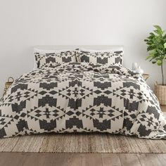 a bed with black and white designs on it