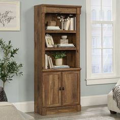 a wooden bookcase in a living room