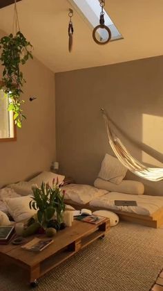 a living room with a hammock hanging from the ceiling