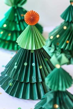 paper christmas trees with orange and green decorations