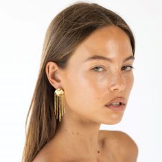 Meet the Marisol Drop Earring, our new Go-To piece for a night out. The Marisol features a stunning 18k gold plating with little chains dripping down creating a beautiful movement. 2 1/2" Water & tarnish resistant Made to last Tarnish Resistant Dangle Jewelry For Evening, Gold Plated Dangle Jewelry For Evening, Gold Plated Long Drop Evening Jewelry, Gold Plated Long Drop Jewelry For Evening, Evening Gold Plated Long Drop Jewelry, Gold-plated Dangle Linear Earrings For Evening, Gold Plated Dangle Linear Earrings For Evening, Gold Chain Drop Earrings For Party, Party Earrings In Yellow Gold With Adjustable Chain